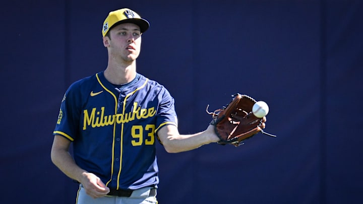 Jacob Misiorowski plays catch before a spring training game.