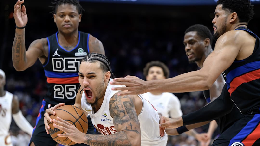 Feb 27, 2026; Detroit, Michigan, USA;   Cleveland Cavaliers guard Jaylon Tyson (20) grabs a rebound away from Detroit Pistons guard Marcus Sasser (25) and Detroit Pistons forward Tobias Harris (right) in the second half at Little Caesars Arena. Mandatory Credit: Lon Horwedel-Imagn Images