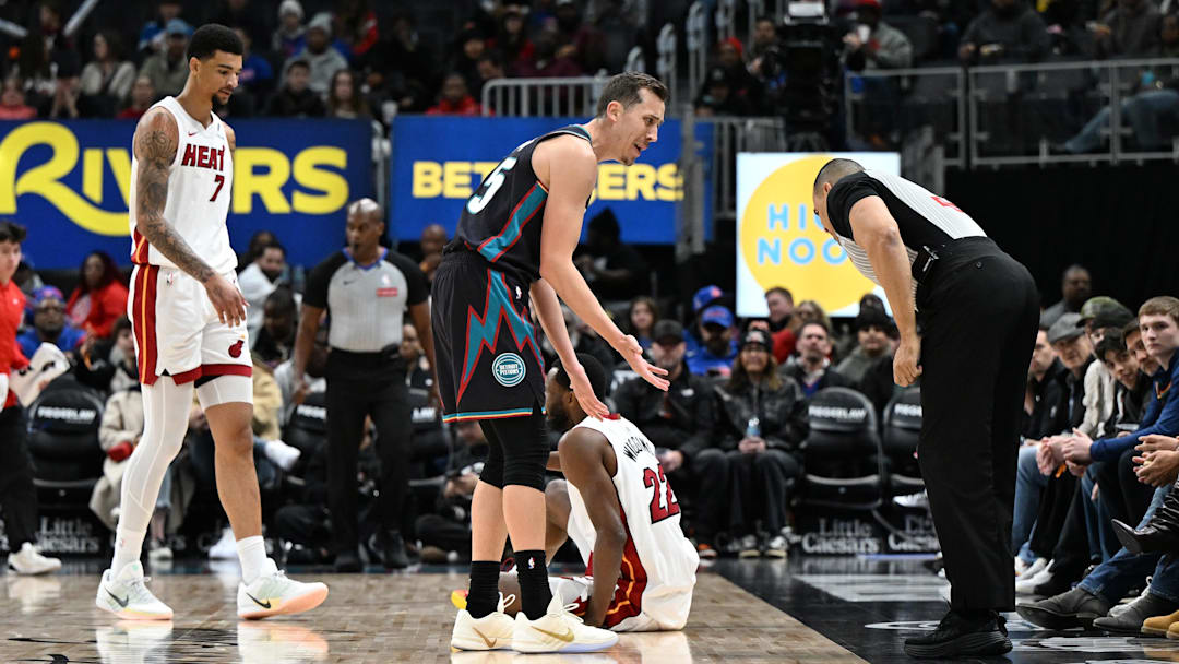 Jan 1, 2026; Detroit, Michigan, USA; Detroit Pistons forward Duncan Robinson (55) argues with referee Curtis Blair (74) after being called for a foul against the Miami Heat in the first quarter at Little Caesars Arena. Mandatory Credit: Lon Horwedel-Imagn Images