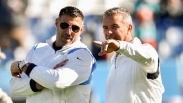 Tennessee Titans head coach Mike Vrabel and Jacksonville Jaguars head coach Urban Meyer talk before their teams face each other at Nissan Stadium Sunday, Dec. 12, 2021 in Nashville, Tenn.