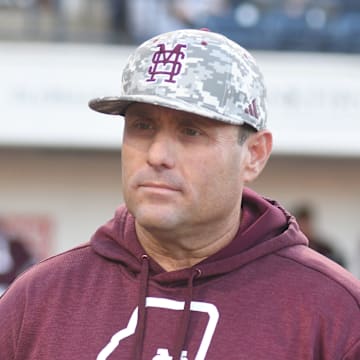 Mississippi State head coach Chris Lemonis listens to the ground rules before the game against Ole Miss at Swayze Field in Oxford, Miss., on Friday, Apr. 12, 2024.