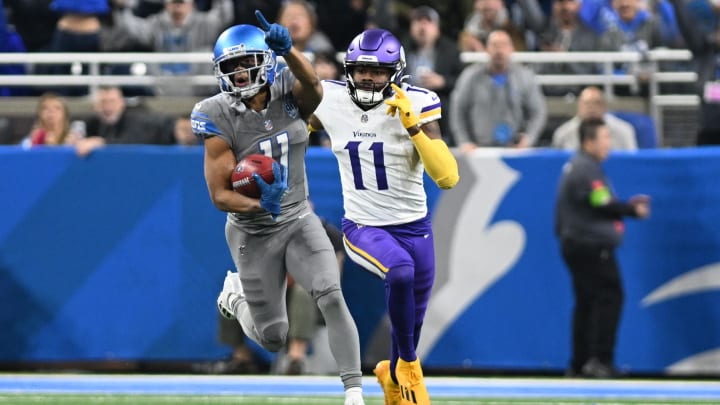 Jan 7, 2024; Detroit, Michigan, USA; Detroit Lions punt returner Kalif Raymond (11) points upfield while being chased by Minnesota Vikings cornerback NaJee Thompson (11) on a punt return in the first quarter at Ford Field. Mandatory Credit: Lon Horwedel-USA TODAY Sports