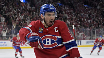 Apr 25, 2025; Montreal, Quebec, CAN; Montreal Canadiens forward Nick Suzuki (14) celebrates after scoring a goal against the Washington Capitals during the second period in game three of the first round of the 2025 Stanley Cup Playoffs at the Bell Centre. Mandatory Credit: Eric Bolte-Imagn Images