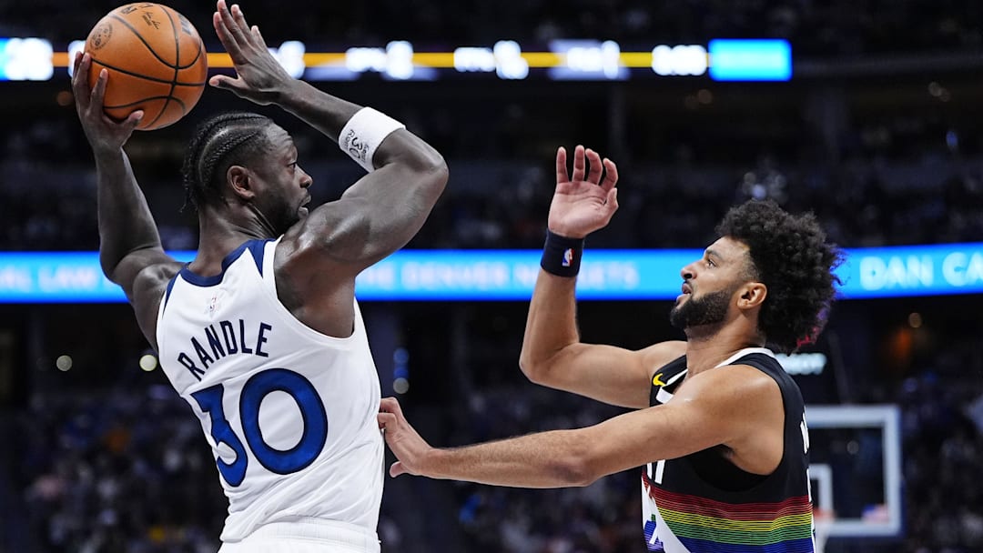 Dec 25, 2025; Denver, Colorado, USA; Minnesota Timberwolves forward Julius Randle (30) attempts to pass the ball against Denver Nuggets guard Jamal Murray (27) during the first half at Ball Arena. Dec 25, 2025; Denver, Colorado, USA; Minnesota Timberwolves forward Julius Randle (30) attempts to pass the ball against Denver Nuggets guard Jamal Murray (27) during the first half at Ball Arena.
