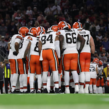 The Cleveland Browns huddle against the Houston Texans in a 2024 AFC wild card game.