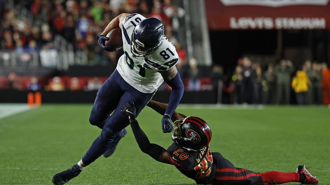 Jan 3, 2026; Santa Clara, California, USA; Seattle Seahawks tight end Eric Saubert (81) makes a catch against San Francisco 49ers cornerback Upton Stout (20) during the second half at Levi's Stadium. Mandatory Credit: Sergio Estrada-Imagn Images