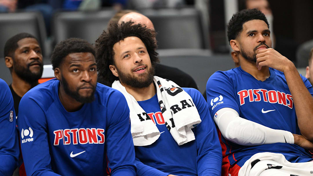 Dec 12, 2025; Detroit, Michigan, USA; Detroit Pistons guard Cade Cunningham (2) center watches from the bench as the Pistons pull away from the Atlanta Hawks in the fourth quarter at Little Caesars Arena. Mandatory Credit: Lon Horwedel-Imagn Images