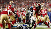 Nov 24, 2025; Santa Clara, California, USA; San Francisco 49ers running back Christian McCaffrey (23) rushes for a touchdown against the Carolina Panthers during the second half at Levi's Stadium. Mandatory Credit: Kelley L Cox-Imagn Images