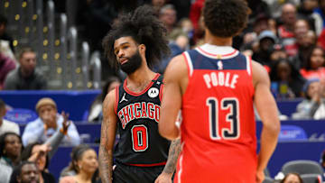Jan 1, 2025; Washington, District of Columbia, USA; Chicago Bulls guard Coby White (0) reacts after Washington Wizards guard Jordan Poole (13) makes a field goal during the fourth quarter at Capital One Arena. Mandatory Credit: Reggie Hildred-Imagn Images