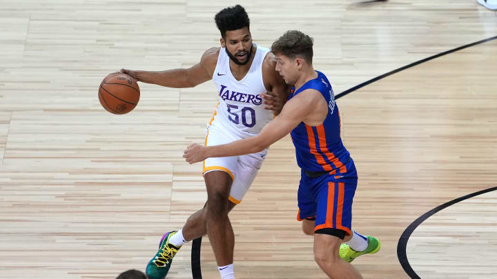 Aug 11, 2021; Las Vegas, Nevada, USA; Los Angeles Lakers forward Yoeli Childs (50) dribbles against New York Knicks guard Rokas Jokubaitis (0) during an NBA Summer League game at Thomas & Mack Center. Mandatory Credit: Stephen R. Sylvanie-USA TODAY Sports