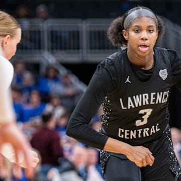 Lawrence Central High School sophomore Lola Lampley (3) drives toward the basket during the second half of an IHSAA class 4A girls    basketball state finals game against Lake Central high School, Saturday, Feb. 24, 2024, at Gainbridge Fieldhouse, in Indianapolis. Lawrence Central won the school   s first state championship title in girl   s basketball.