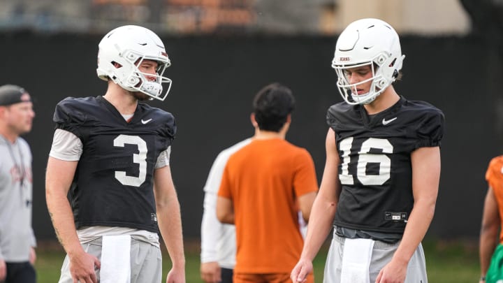 Quarterbacks Quinn Ewers (3) and Arch Manning (16) talk during the first Texas Longhorns football practice of 2023 at the Frank Denius Fields on the University of Texas at Austin campus on Monday, March 6, 2023.