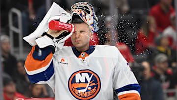 Nov 21, 2024; Detroit, Michigan, USA; New York Islanders goaltender Ilya Sorokin (30) sprays water on his face during a time out against the Detroit Red Wings in the second period at Little Caesars Arena. Mandatory Credit: Lon Horwedel-Imagn Images