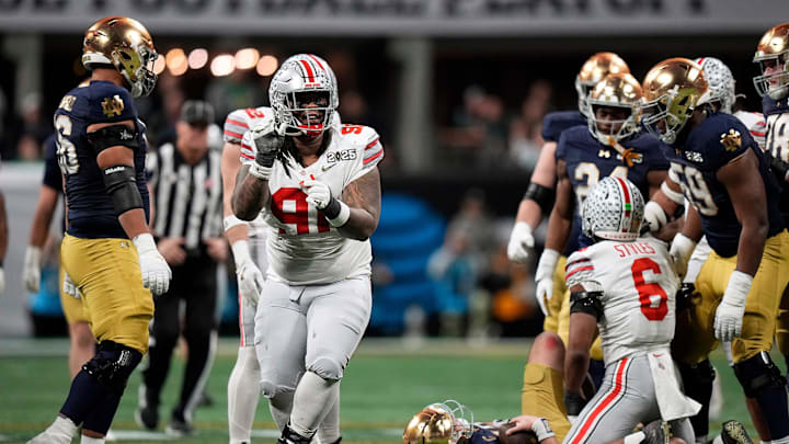 ARIZONA CARDINALS: Ohio State Buckeyes defensive tackle Tyleik Williams (91) celebrates a sack against Notre Dame Fighting Irish in the third quarter during the College Football Playoff championship at Mercedes-Benz Stadium in Atlanta on January 20, 2025. ARIZONA CARDINALS: Ohio State Buckeyes defensive tackle Tyleik Williams (91) celebrates a sack against Notre Dame Fighting Irish in the third quarter during the College Football Playoff championship at Mercedes-Benz Stadium in Atlanta on January 20, 2025.