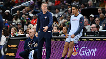 Dec 30, 2024; Washington, District of Columbia, USA; Washington Wizards head coach Brian Keefe looks on with Washington Wizards guard Malcolm Brogdon (15) during the second quarter against the New York Knicks at Capital One Arena. Mandatory Credit: Reggie Hildred-Imagn Images