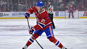 Sep 23, 2025; Montreal, Quebec, CAN; Montreal Canadiens defenseman Kaiden Guhle (21) plays the puck during the first period against the Philadelphia Flyers at the Bell Centre. Mandatory Credit: Eric Bolte-Imagn Images