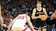 Dec 21, 2024; Newark, New Jersey, USA; Princeton Tigers forward Caden Pierce (3) looks to pass while being defended by Rutgers Scarlet Knights center Zach Martini (99) during the second half at Prudential Center. Mandatory Credit: Tom Horak-Imagn Images