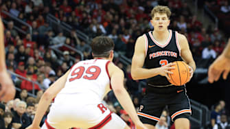 Dec 21, 2024; Newark, New Jersey, USA; Princeton Tigers forward Caden Pierce (3) looks to pass while being defended by Rutgers Scarlet Knights center Zach Martini (99) during the second half at Prudential Center. Mandatory Credit: Tom Horak-Imagn Images