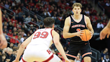 Dec 21, 2024; Newark, New Jersey, USA; Princeton Tigers forward Caden Pierce (3) looks to pass while being defended by Rutgers Scarlet Knights center Zach Martini (99) during the second half at Prudential Center. Mandatory Credit: Tom Horak-Imagn Images