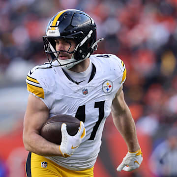 Dec 1, 2024; Cincinnati, Ohio, USA; Pittsburgh Steelers linebacker Payton Wilson (41) picks up the fumble en route to scoring a defensive touchdown during the fourth quarter against the Cincinnati Bengals at Paycor Stadium. Mandatory Credit: Joseph Maiorana-Imagn Images