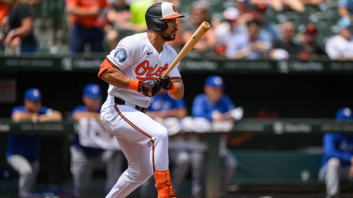 Jul 31, 2024; Baltimore, Maryland, USA; Baltimore Orioles outfielder Anthony Santander (25) hits a single against the Toronto Blue Jays during the first inning at Oriole Park at Camden Yards.