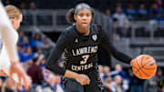 Lawrence Central High School sophomore Lola Lampley (3) drives toward the basket during the second half of an IHSAA class 4A girls    basketball state finals game against Lake Central high School, Saturday, Feb. 24, 2024, at Gainbridge Fieldhouse, in Indianapolis. Lawrence Central won the school   s first state championship title in girl   s basketball.