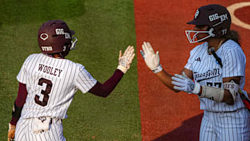 Texas A&M infielder Koko Wooley (3) high fives outfielder Jazmine Hill (77) after a score during the game three NCAA Super Regional against the Texas Longhorns at Red & Charline McCombs Field on Sunday, May 26, 2024 in Austin.
