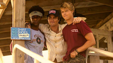 Outer Banks. (L to R) Jonathan Daviss as Pope, Chase Stokes as John B, Rudy Pankow as JJ in episode 401 of Outer Banks. Cr. Jackson Lee Davis/Netflix © 2024