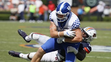 Sep 26, 2020; Auburn, Alabama, USA;  Kentucky Wildcats tight end Justin Rigg protects the ball as Auburn Tigers linebacker K.J. Britt (33) makes a tackle during the third quarter at Jordan-Hare Stadium. Mandatory Credit: John Reed-Imagn Images