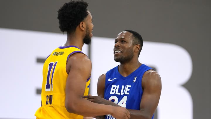 Dec 21, 2021; Las Vegas, NV, USA; Delaware Blue Coats guard Jared Brownridge (24) talks with South Bay Lakers guard Elijah Cain (11) during the fourth quarter at Mandalay Bay Convention Center. Mandatory Credit: Stephen R. Sylvanie-USA TODAY Sports