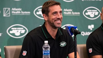 Apr 26, 2023; Florham Park, NJ, USA; New York Jets quarterback Aaron Rodgers (8) smiles during the introductory press conference at Atlantic Health Jets Training Center. Mandatory Credit: Tom Horak-Imagn Images