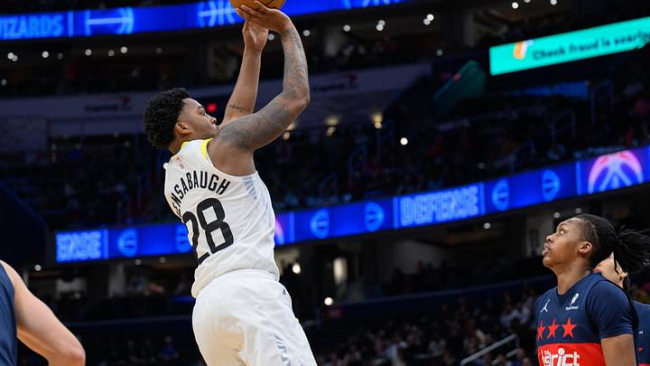 Mar 5, 2025; Washington, District of Columbia, USA; Utah Jazz forward Brice Sensabaugh (28) takes a jump shot over Washington Wizards guard Bub Carrington (8) during the fourth quarter at Capital One Arena. Mandatory Credit: Reggie Hildred-Imagn Images