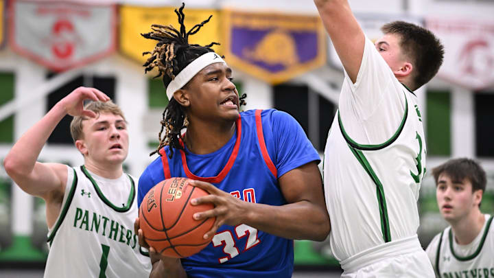 Wisconsin Lutheran forward Jamail Sewell (32) works inside against Greendale guard Korben Pfeifer (33) in a Woodland Conference West Division game Tuesday, January 20, 2026.