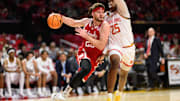 Jan 19, 2025; College Park, Maryland, USA; Nebraska Cornhuskers forward Andrew Morgan (23) drives to the basket against Maryland Terrapins center Derik Queen (25) during the first half at Xfinity Center.