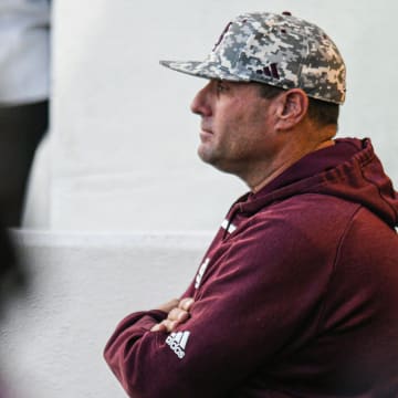 Mississippi State head coach Chris Lemonis watches from the dugout against Ole Miss at Swayze Field in Oxford, Miss., on Friday, Apr. 12, 2024.