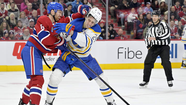 Jan 4, 2024; Montreal, Quebec, CAN; Montreal Canadiens defenseman Mike Matheson (8) punches Buffalo Sabres forward Dylan Cozens (24) during the third period at the Bell Centre. Mandatory Credit: Eric Bolte-Imagn Images