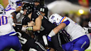 Oct 12, 2024; Honolulu, Hawaii, USA;  Boise State Broncos defensive tackle Braxton Fely (90) sacks Hawaii Rainbow Warriors quarterback Brayden Schager (13) during the second quarter at Clarence T.C. Ching Athletics Complex. Mandatory Credit: Marco Garcia-Imagn Images