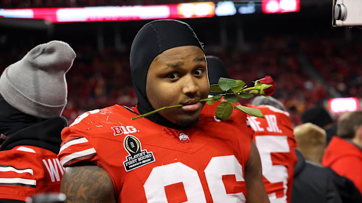 Ohio State Buckeyes defensive end Eddrick Houston (96) celebrates the win as he carries a rose after the game against the Tennessee Volunteers at Ohio Stadium. 
