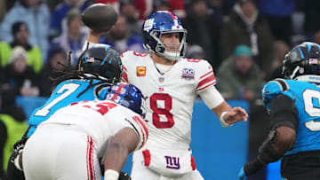 Nov 10, 2024; Munich, Germany; New York Giants quarterback Daniel Jones (8) throws the ball against the Carolina Panthers in the first half during the 2024 NFL Munich Game at Allianz Arena. Mandatory Credit: Kirby Lee-Imagn Images