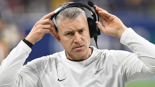 Dec 2, 2023; Detroit, MI, USA;  Toledo Rockets head coach Jason Candle puts on his head set before the MAC Championship game against the Miami RedHawks at Ford Field. Mandatory Credit: Lon Horwedel-USA TODAY Sports