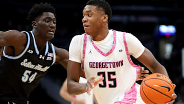 Feb 8, 2025; Washington, District of Columbia, USA; Georgetown Hoyas forward Thomas Sorber (35) drives past Seton Hall Pirates center Godswill Erheriene (54) during the first half at Capital One Arena. Mandatory Credit: Daniel Kucin Jr.-Imagn Images