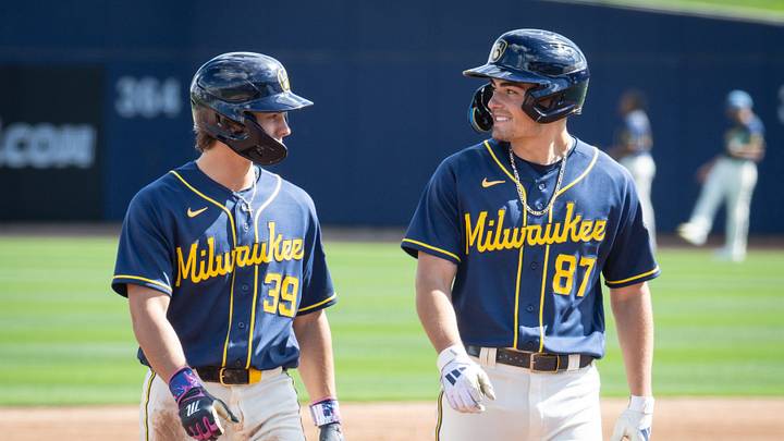 Milwaukee Brewers infield prospects Josh Adamczewski and Brady Ebel walk off the field during spring training workouts Tuesday, February 17, 2026, at American Family Fields of Phoenix in Phoenix, Arizona.