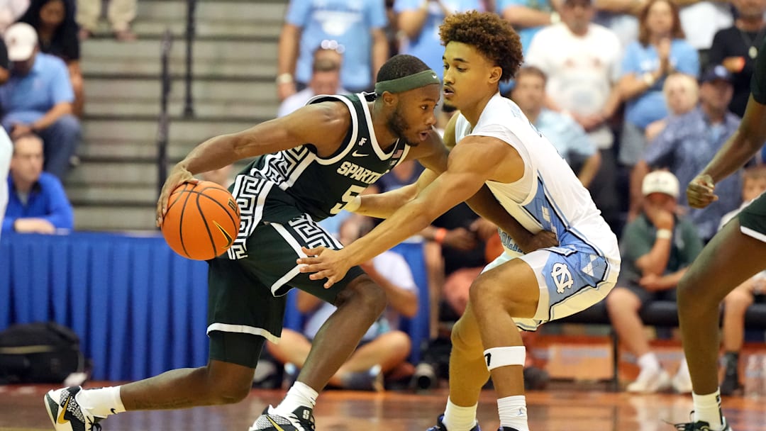 Seth Trimble guarding Tre Holloman at the Maui Invitational