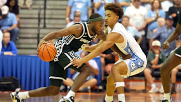 Seth Trimble guarding Tre Holloman at the Maui Invitational