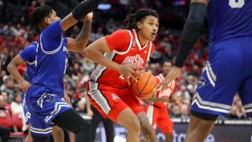 Dec 21, 2023; Columbus, Ohio, USA; Ohio State Buckeyes forward Devin Royal (21) looks to pass as New Orleans Privateers guard Jamond Vincent (13) defends during the second half at Value City Arena. Mandatory Credit: Joseph Maiorana-USA TODAY Sports