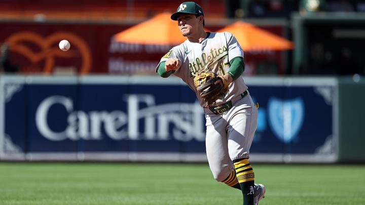 Aug 10, 2025; Baltimore, Maryland, USA; Athletics second baseman Luis Urias (17) throws to first for an out during the ninth inning against the Baltimore Orioles at Oriole Park at Camden Yards. Mandatory Credit: Daniel Kucin Jr.-Imagn Images