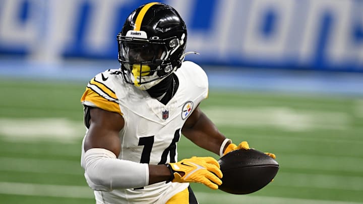 Pittsburgh Steelers wide receiver George Pickens runs upfield after catching a pass against the Detroit Lions.
