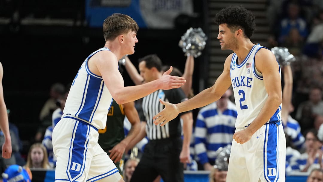 Mar 19, 2026; Greenville, SC, USA; Duke Blue Devils guard Cayden Boozer (2) reacts against the Siena Saints in the second half during a first round game of the men's 2026 NCAA Tournament at Bon Secours Wellness Arena. Mandatory Credit: Bob Donnan-Imagn Images