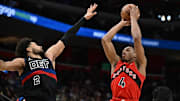 Jan 11, 2025; Detroit, Michigan, USA;  Toronto Raptors forward Scottie Barnes (4) shoots the ball over Detroit Pistons guard Cade Cunningham (2) in the third quarter at Little Caesars Arena. Mandatory Credit: Lon Horwedel-Imagn Images