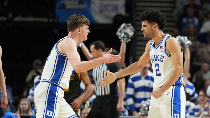 Mar 19, 2026; Greenville, SC, USA; Duke Blue Devils guard Cayden Boozer (2) reacts against the Siena Saints in the second half during a first round game of the men's 2026 NCAA Tournament at Bon Secours Wellness Arena. Mandatory Credit: Bob Donnan-Imagn Images